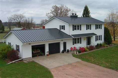 white house with charcoal gray metal roof|light grey roof white house.